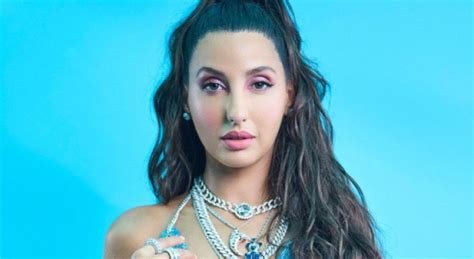 nora sexy pic|Photos: Nora Fatehi raises temperature in nude thigh。